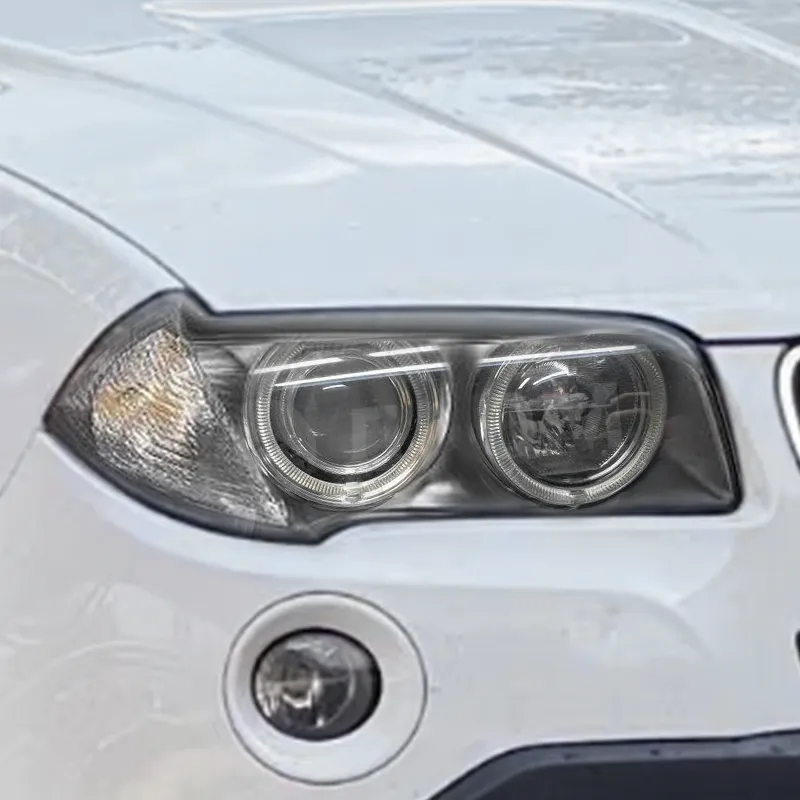 BMW X3 E83 tehase biksenoonesituli projektorläätse ja valgusrõngastega